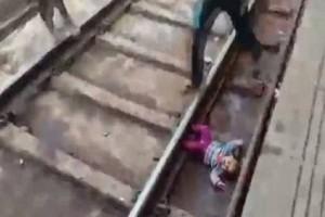 Watch - One-year-old survives unhurt after train passes over