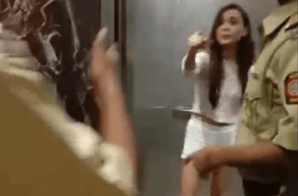 Woman strips inside elevator after heated argument with cops