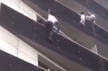 Real life \'spider man\' climbs building to save dangling boy in Paris