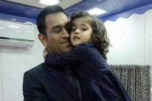Adorable! Watch Dhoni play around with little girl