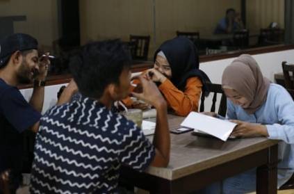 Indonesia\'s aceh bans men and women to dine together
