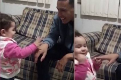 little girl using sign language to communicate with her dad little girl using sign language to communicate with her dad