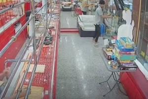 Watch: Bumbling robber gets stuck inside store he tried to loot